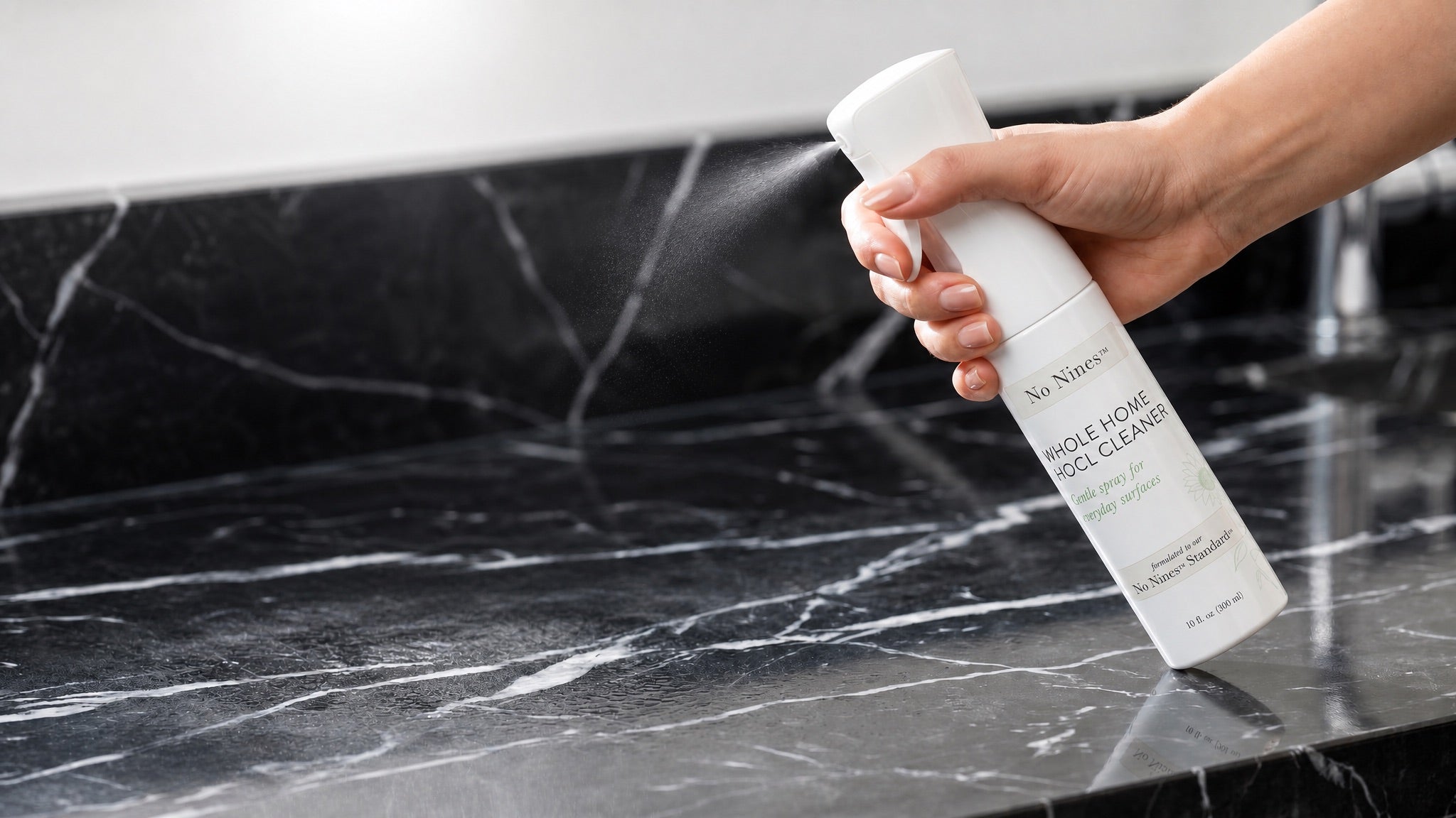 multi-surface-spray-in-use-marble-counter.jpg